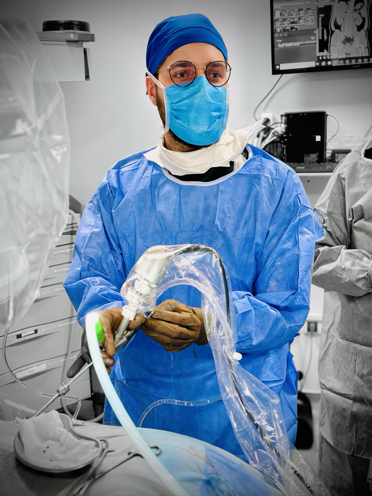 Abdullah Harun Kınık, MD, working with endoscopic equipment in the operating room